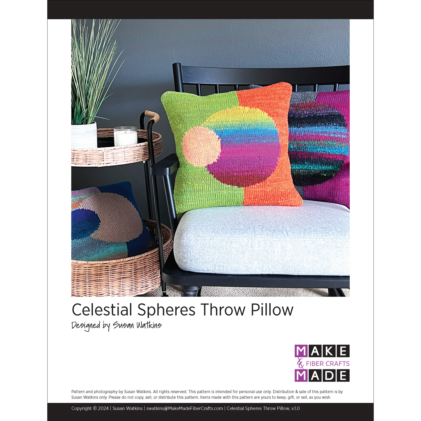 This intarsia design features a split background of one color on the  left and another color on the right. In the center is a large sphere in a third color. A smaller sphere is overlapping, in a complementary color.