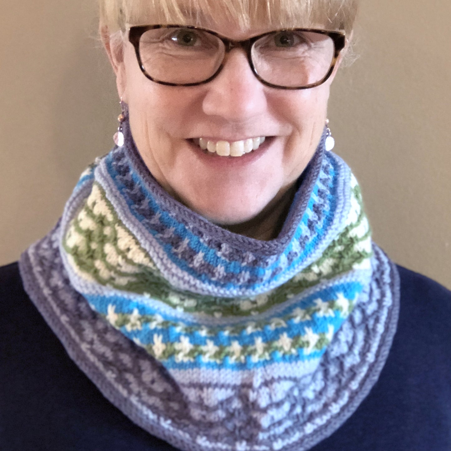 Susan models the Labadee Cowl, with a tapered shape that eliminates extra bulk while maintaining warmth.