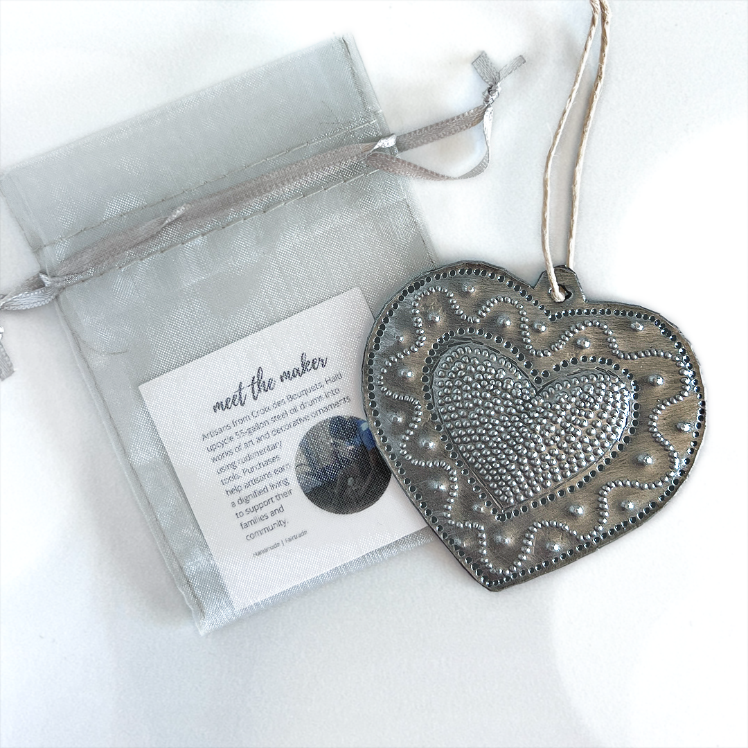 Each steel drum Haitian Heart ornament comes in a silver organza drawstring pouch... perfect for giving as a holiday gift.