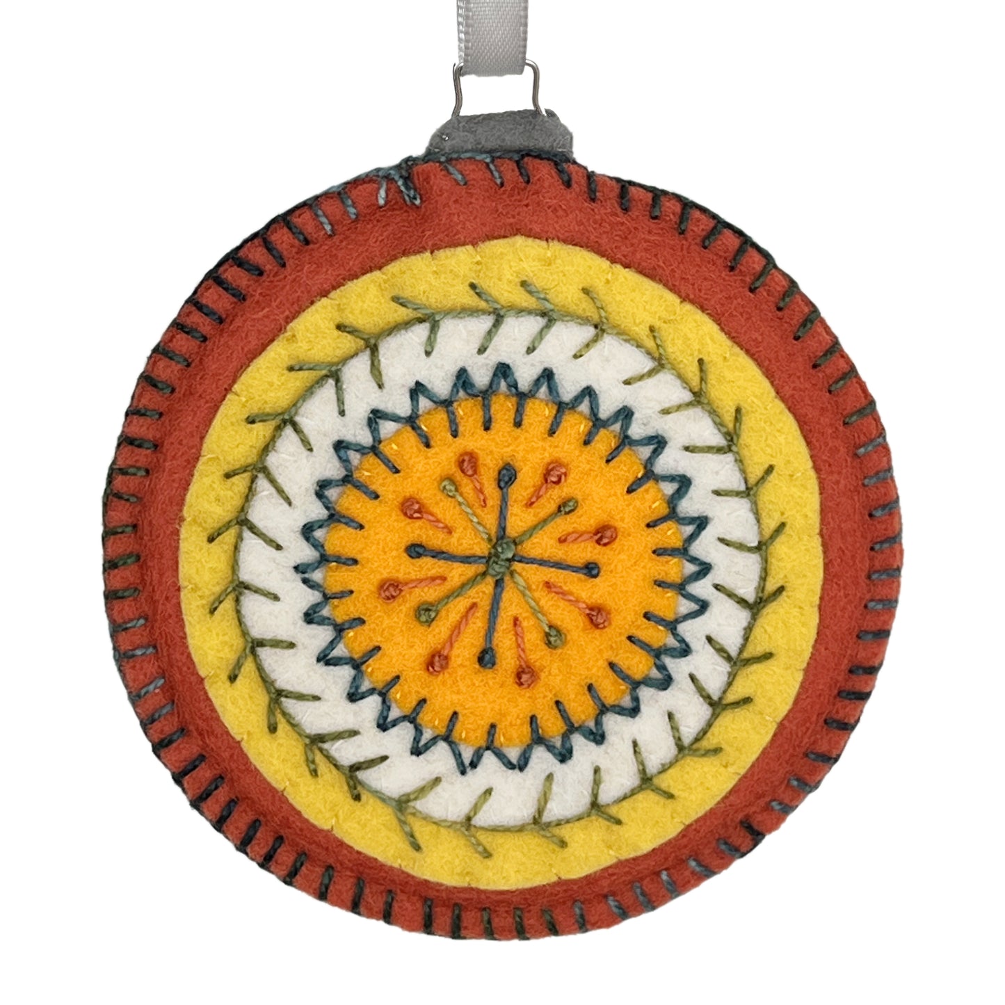 Ornament made from 100% wool felt, displaying concentric circles of orange, yellow, and white, embellished with detailed hand embroidery.