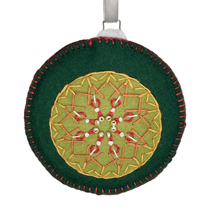 Wool felt ornament featuring two shades of green felt with delicate embroidery in red and gold with small silver Czech beads in the center.