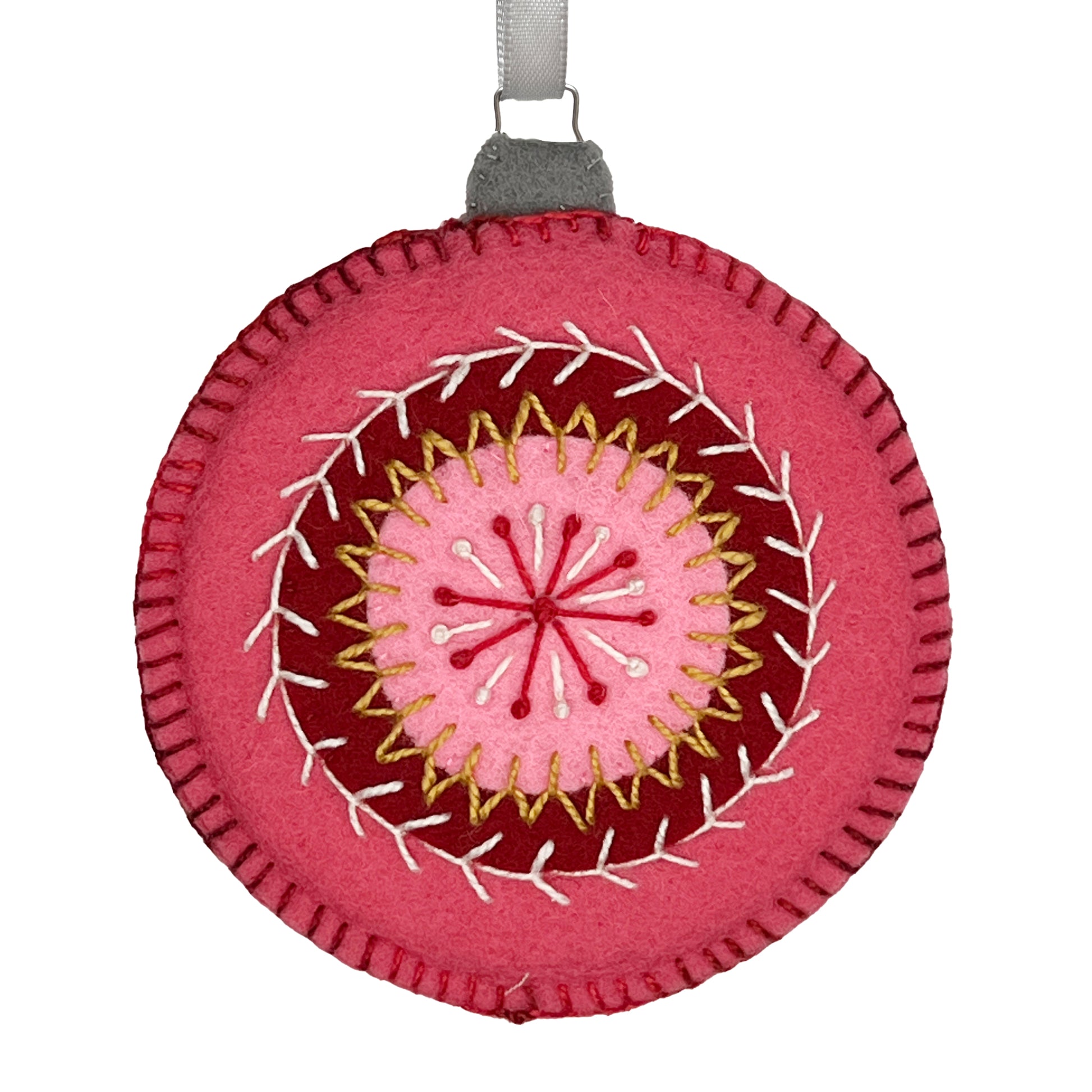 Ornament made from 100% wool felt, displaying concentric circles of rose, cranberry, and pink, embellished with detailed hand embroidery.