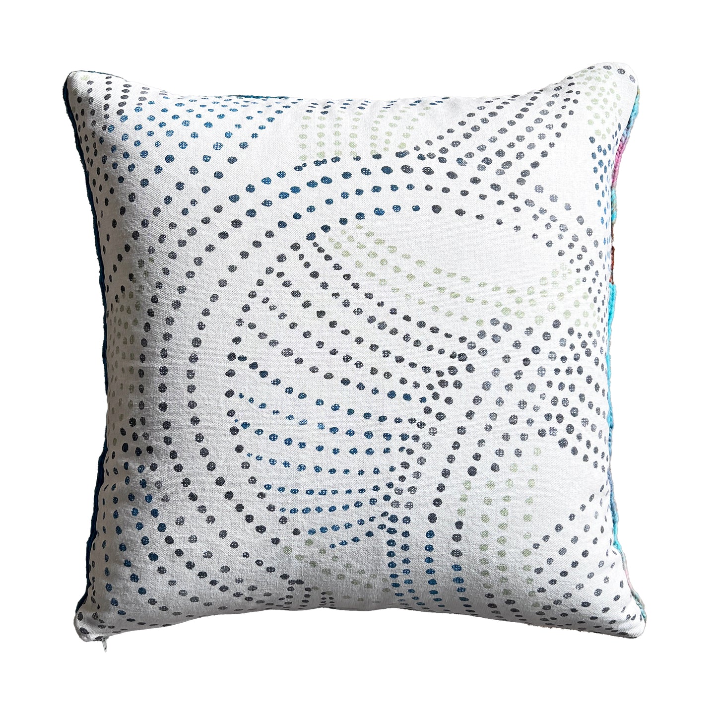 Featuring a hidden side zipper, this hand-sewn, removable pillow cover is backed with natural cotton canvas patterned with colored dots.