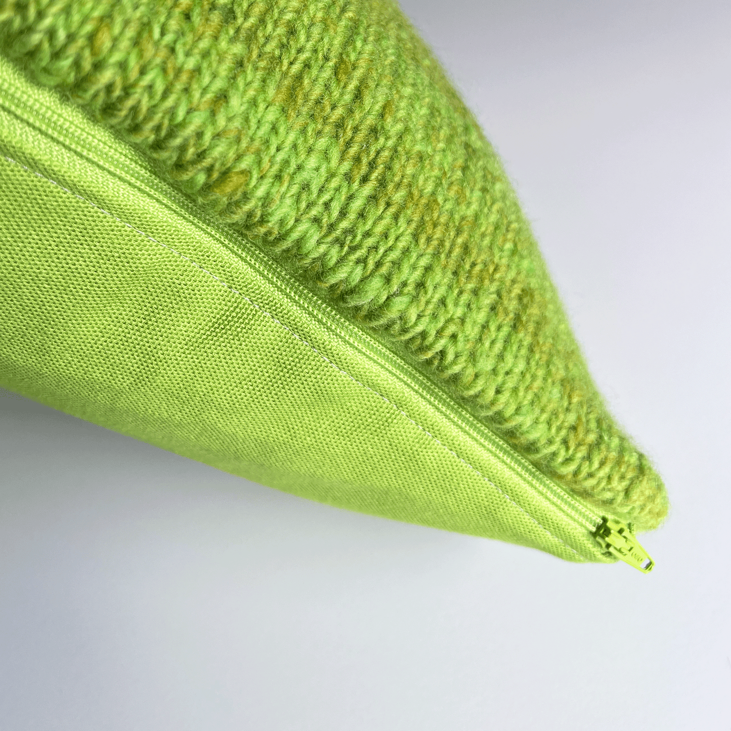 A lime green side zipper makes this hand-sewn decorative throw pillow cover easy to remove for spot cleaning and/or hand washing.