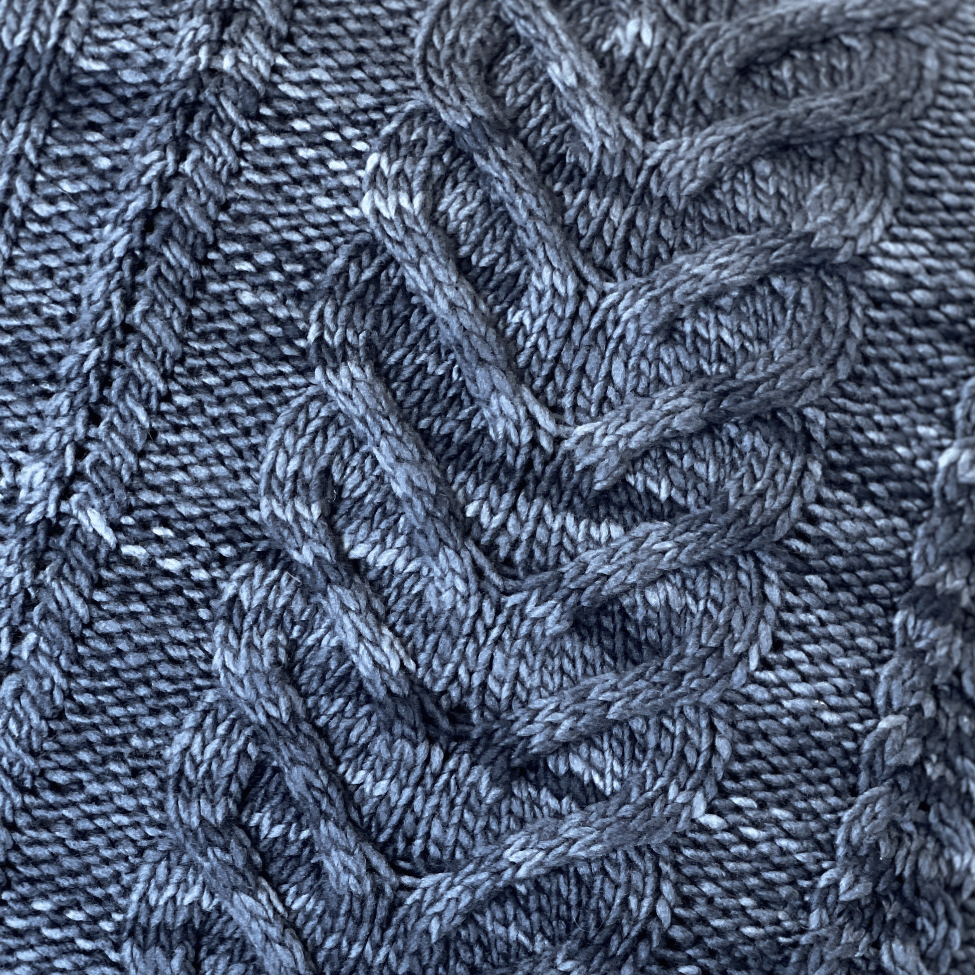 Manos del Uruquay's yarns are hand-dyed by artisans in the Uruguayan countryside. The tonal variations in this denim / steel blue merino wool adds depth to the solid colorway.