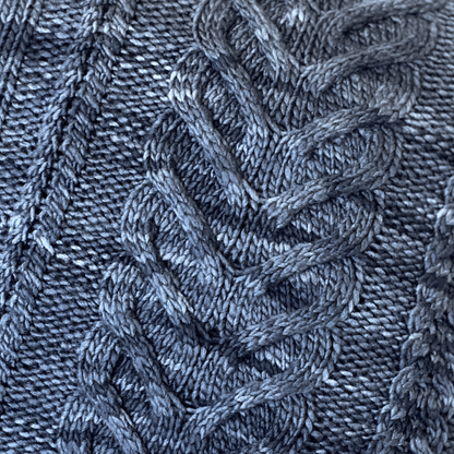 Manos del Uruquay's yarns are hand-dyed by artisans in the Uruguayan countryside. The tonal variations in this denim / steel blue merino wool adds depth to the solid colorway.