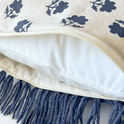 A muslin lining hides the seams in this decorative pillow, with a side zipper that's covered by the pillow's unique fringe.