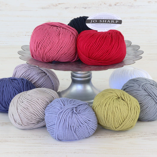 Balls of Jo Sharp's Desert Garden Cotton Aran Yarn in various colors