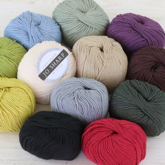 Multiple balls of Jo Sharp's Soho Summer Cotton DK Yarn in various colors