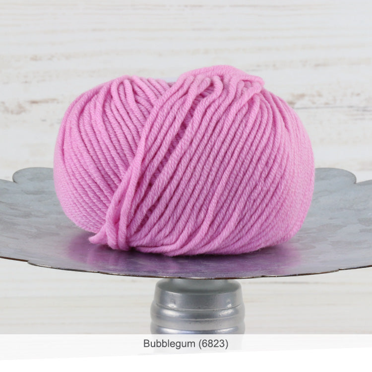One ball of Trendsetter's Merino VIII superwash wool yarn in color #6823 - Bubblegum