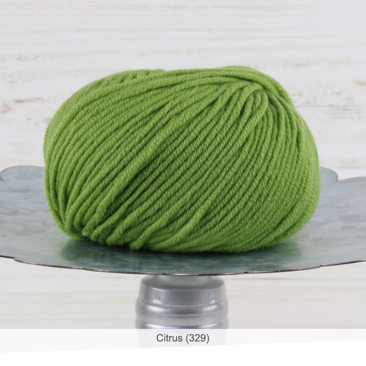 One ball of Trendsetter's Merino VIII superwash wool yarn in color #329 - Citrus