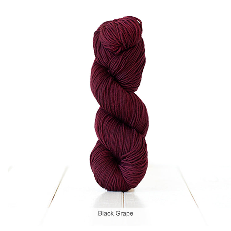 One skein of Urth's Harvest DK Yarn in color Black Grape