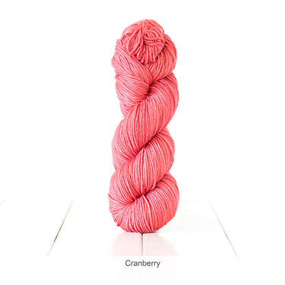 One skein of Urth's Harvest DK Yarn in color Cranberry
