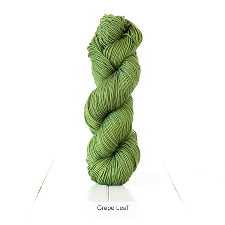 One skein of Urth's Harvest DK Yarn in color Grape Leaf